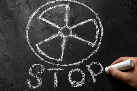 writes stop under the symbol of nuclear weapons and radiationの写真素材