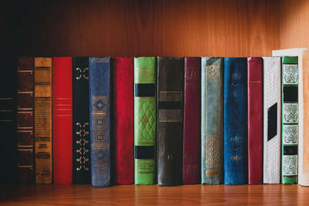 old color hardback books on the bookshelf. concept study, education