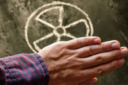 hand and nuclear weapon symbol concept renounce nuclear weaponの写真素材