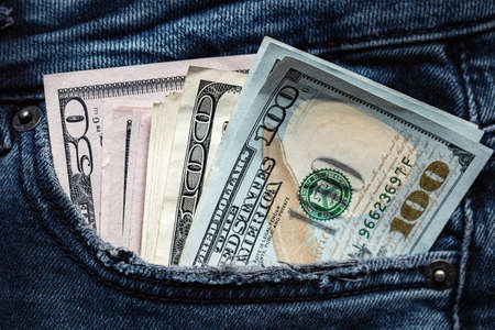 jeans pocket with money bills close up