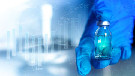holding vaccine in hand amid incidence graph vaccination