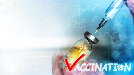vaccination closeup vaccine and syringe in doctor's hand with place for text concept vaccination stop virusの写真素材