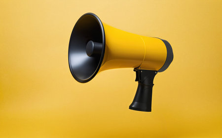 megaphone on a yellow background close-upの素材