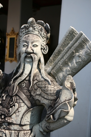 Statue of chinese guard at Wat Arun in Bangkokの写真素材