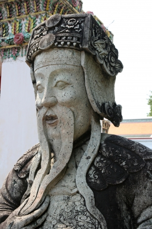 Statue of chinese guard at Wat Arun in Bangkokの写真素材