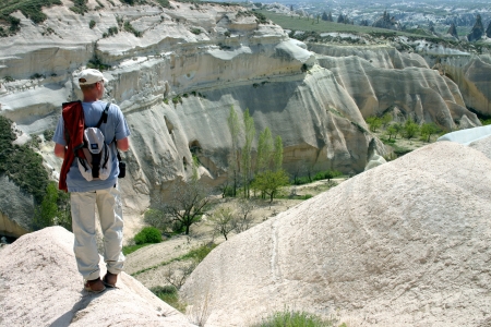 Hiker looking over Rose valley, Cappadocia, Turkeyの写真素材