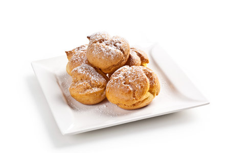 cream and chocolate puffs isolated on white backgroundの写真素材