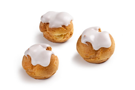 cream and chocolate puffs isolated on white backgroundの写真素材