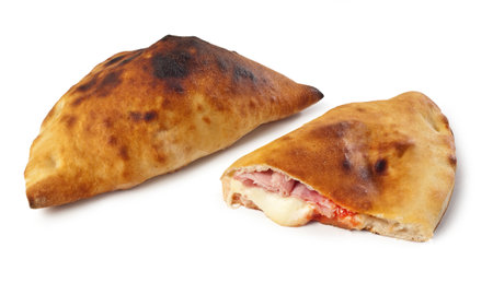 "Calzone" Italian Takeout Folded Pizza with Cooked Ham, Tomato Sauce and Mozzarella Cheese - Isolated on White Backgroundの写真素材
