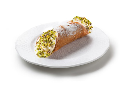 Cannoli with Icing Sugar on White Plate, Isolated - Original Sicilian "Cannolo" Dessert with Pistachio Granella, Sweet Ricotta Cream Cheese and Fried Pastry Dough - Close-Up Macro, White Backgroundの写真素材