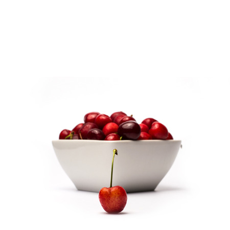 Bowl of Cherries on white backgroundの写真素材