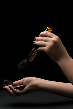 Make up brush with handsの写真素材