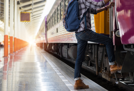 Young traveler with backpack in the railway.の写真素材