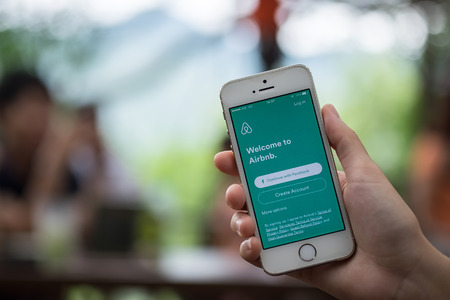 CHIANG MAI, THAILAND - JULY 16 2016: Apple iPhone 5s  Showing Airbnb application on the screen. Airbnb is a website for people to list, find, and rent lodging.のeditorial素材