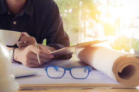 close up hand of young man working on his plane project at site construction work.の写真素材