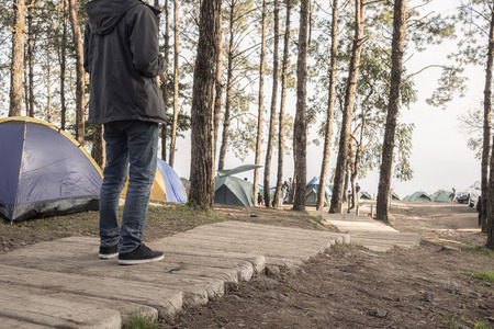 Man Traveler relaxing alone in Mountains Travel Lifestyle concept cloudy nature landscape on backgroundの写真素材
