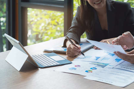 Fund managers team consultation and discuss about analysis Investment stock market by document paper. Fund investment concept.の写真素材