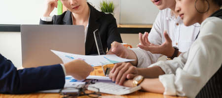 Group of Businessman and Accountant checking data document on digital tablet for investigation of...