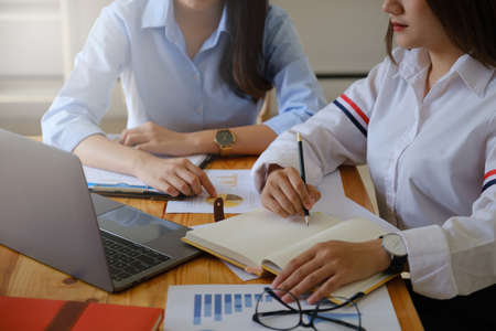 Young creative asian businesswoman meeting at office and focus content on laptop. Brainstorming...