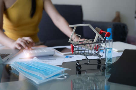 Young freelancer Start up owner calculating from customer order at home office,  Small Business Entrepreneur SME, Shipping shopping online.の写真素材