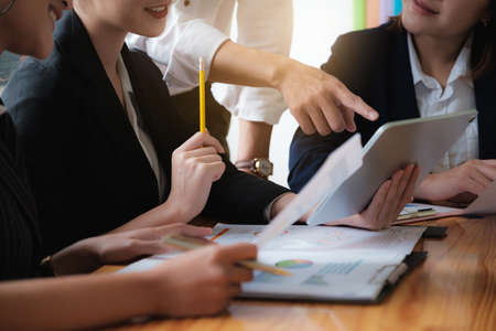 Group of Businessman and Accountant brainstorming with digital tablet for investigation of corruption account . Anti Bribery concept.の写真素材