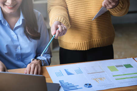 Fund managers team consultation and discuss about analysis Investment stock market by financial report.の写真素材