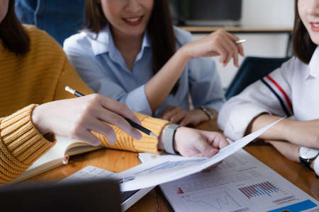 Group of business brainstorm investment consultant analyzing company financial report balance...