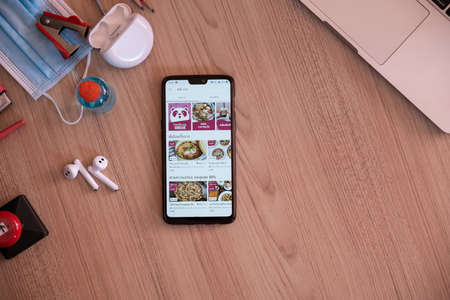 CHIANG MAI, THAILAND - MAY 16, 2020 : Smartphone showing food panda app on screen. Food panda is food delivery most popular in situation covid-19 and quarantine.のeditorial素材