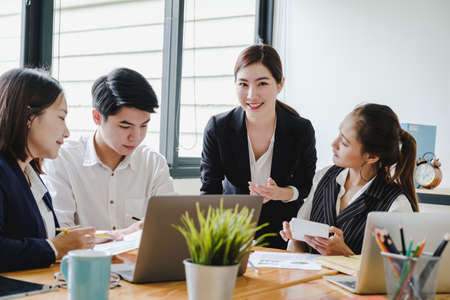 Fund managers team consultation and discuss about analysis Investment stock market by digital tablet.の写真素材
