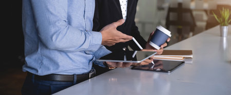 Group of Business man and Accountant checking data document on digital tablet for investigation of...