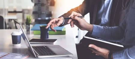 Group of Businessman and Accountant checking data document on digital tablet for investigation of corruption account . Anti Bribery concept.の写真素材