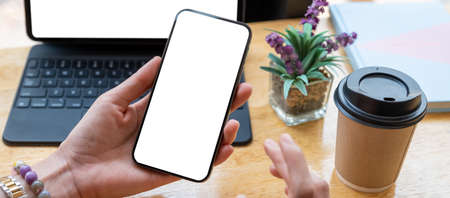 Close up Woman hand holding Mobile Phone.