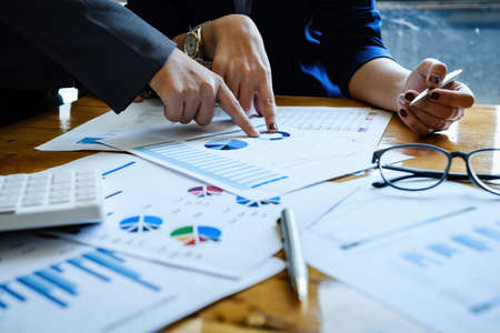 Business People Meeting to discuss and brainstorming the financial report paperwork in home office....
