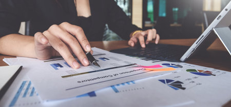 Fund managers consultation and discuss about analysis Investment stock market by data document.