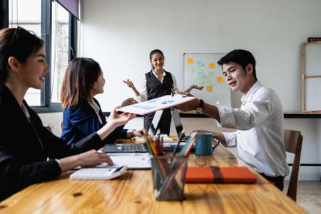 Group of Businessman and Accountant checking data document on digital tablet for investigation of corruption account . Anti Bribery concept. selecetive focusの写真素材