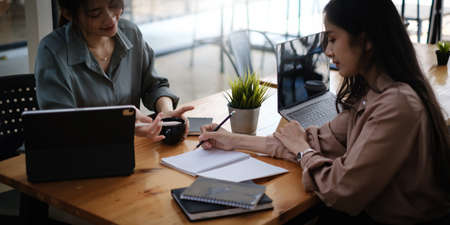 Serious corporate business team discuss and planning paperwork at group briefing. fund manager team...