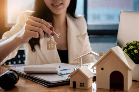 Real estate agent offer hand for customer sign agreement contract signature for buy or sell house. Real estate concept contact agreement concept.の写真素材