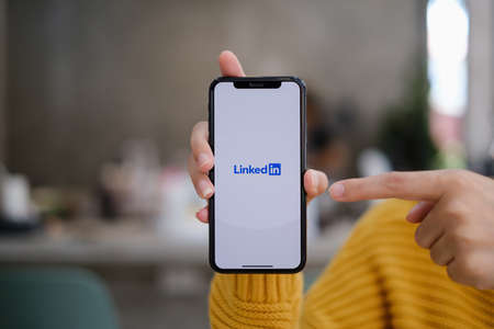 CHIANG MAI, THAILAND: MAY 03, 2021 : LinkedIn logo on phone screen. LinkedIn is a social network for search and establishment of business contacts. It is founded in 2002のeditorial素材