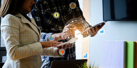 Business team discuss at meeting room with virtual icon. money or insurance concept.の写真素材