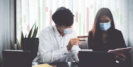 Fund managers researching and analysis Investment stock market by laptop computerの写真素材