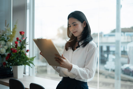 Fund managers researching and analysis Investment stock market by data document in office.の写真素材