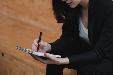 Woman searching for job information amid COVID-19 pandemic.の写真素材