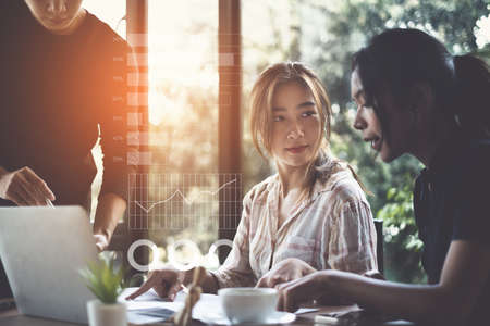 Diversity Business people gather in a corporate location to discuss research using paperwork. Concept of a group of businesses cooperating.の写真素材
