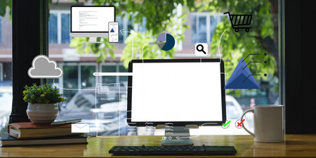 Mockup image of a black tablet with white blank screen on wooden desk.の写真素材