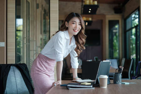 Fund managers researching and analysis Investment stock market by paperwork on wooden desk in officeの写真素材