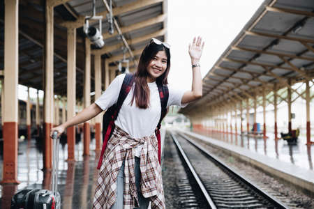 Image of A traveler looking for her friend for travel together. travel concept