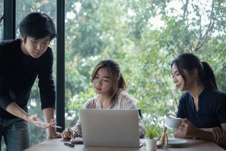 Brainstorming at office briefing concept. Group of Business woman explaining analysis at the meeting startup work.の写真素材
