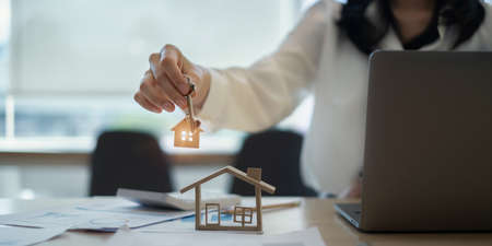 Real estate or broker residential or Agent showing key for house and car rent.の写真素材