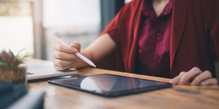 Fund managers consultation and discuss about analysis Investment stock market by application on digital tabletの写真素材