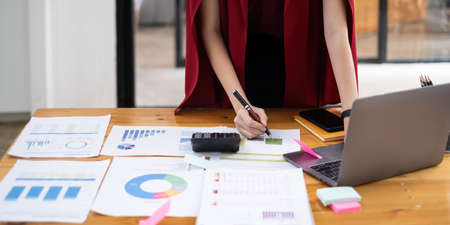 Close-up of a business woman audit the companys budget. Tax information is calculated by accountants.の写真素材